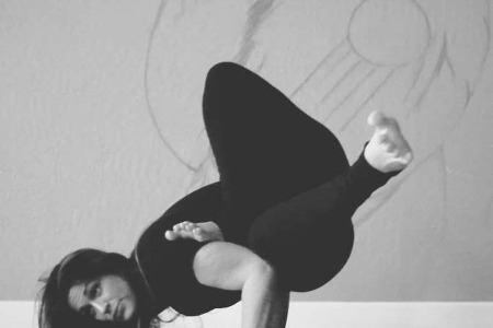 Jenna Lomazzo in an arm balance at Thee House of Yoga, FL