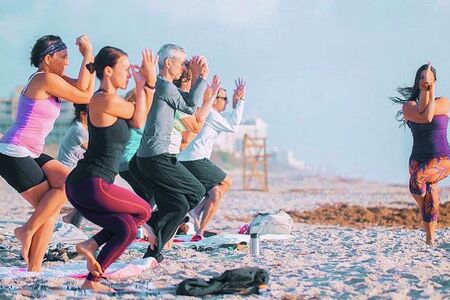 Jenna Lomazzo Teaching Beach Yoga in Florida
