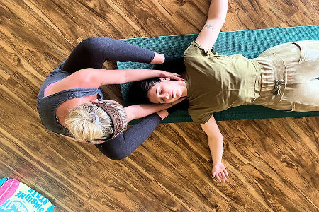 Hands on yoga teacher training.